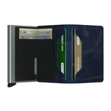 Its slim profile makes the Slimwallet fit perfectly into every pocket. The open exterior is cut extra wide to hold cards, banknotes and receipts. The Cardprotector mechanism allows you to slide out cards with one simple motion, while the aluminium protects your cards from bending, breaking and unwanted wireless communication.