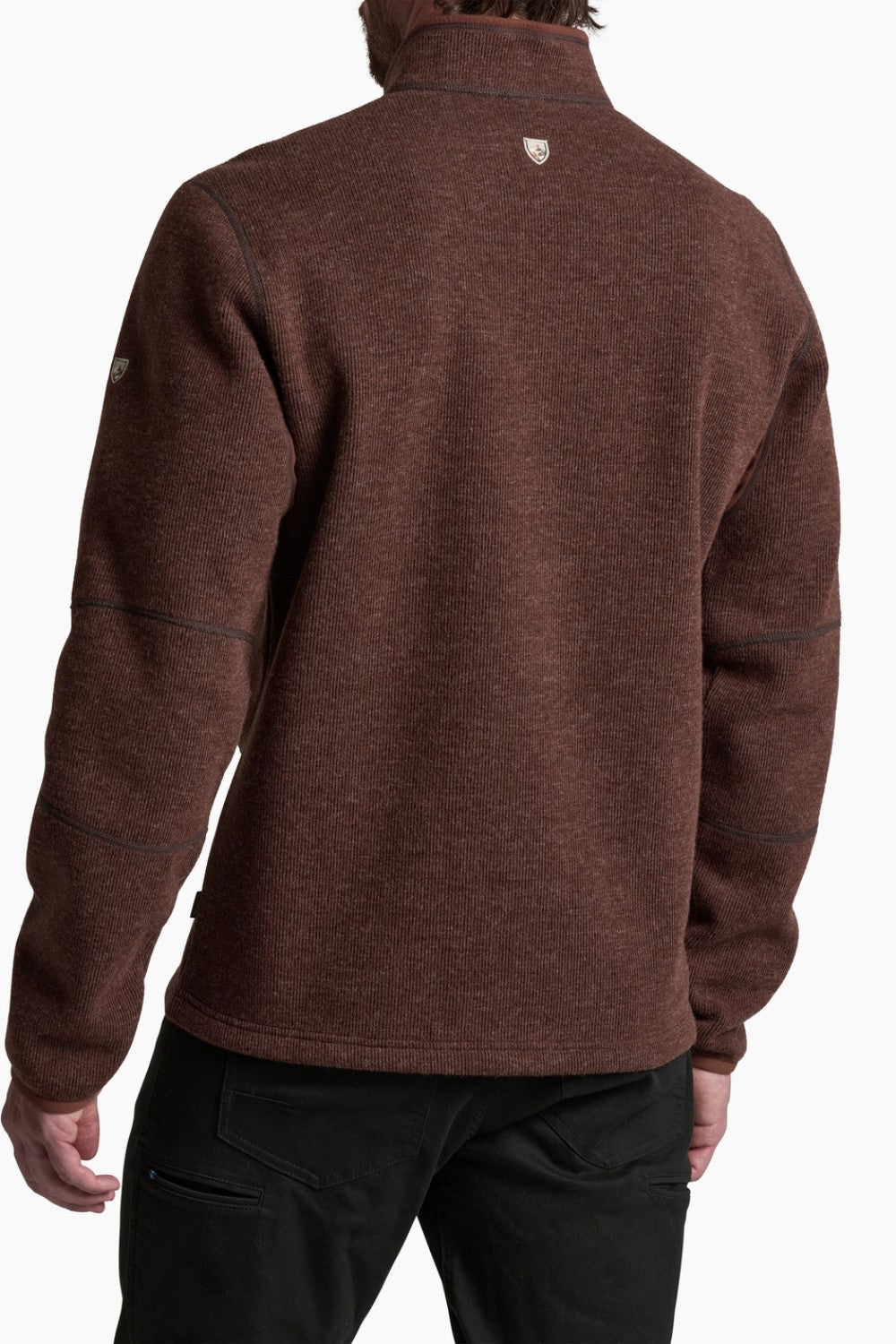 Brown fleece pullover worn by a person on a white background