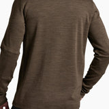 Brown long-sleeve shirt worn by a person on a white background