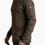 Man wearing a brown long-sleeve shirt on a white background