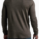 Man wearing a brown long-sleeve shirt with a zipper on a white background