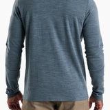 Blue long-sleeve shirt worn by a person on a white background