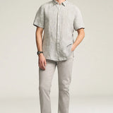 Designed for the man seeking a polished everyday pant, this elegant twill features a cotton, Tencel, and elastane fabrication for an ultra-smooth feel. Cut in a comfortable mid rise with a straight leg and finished in a versatile grey hue.