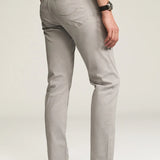 Designed for the man seeking a polished everyday pant, this elegant twill features a cotton, Tencel, and elastane fabrication for an ultra-smooth feel. Cut in a comfortable mid rise with a straight leg and finished in a versatile grey hue.