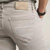 Designed for the man seeking a polished everyday pant, this elegant twill features a cotton, Tencel, and elastane fabrication for an ultra-smooth feel. Cut in a comfortable mid rise with a straight leg and finished in a versatile grey hue.