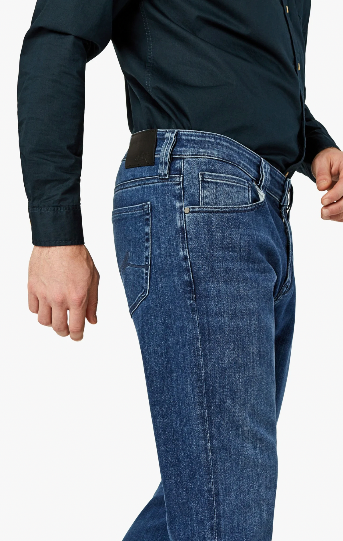 A contemporary fabrication complements the classic styling of this higher-rise, straight leg jean. They are cut from premium stretch denim that has a distinguished, modern appearance in a versatile wash to easily transition from casual to semiformal. Designed with comfort and effortless wear in mind, these have a relaxed fit through the leg that’s tailored to eliminate excess fabric at the hip and thigh.