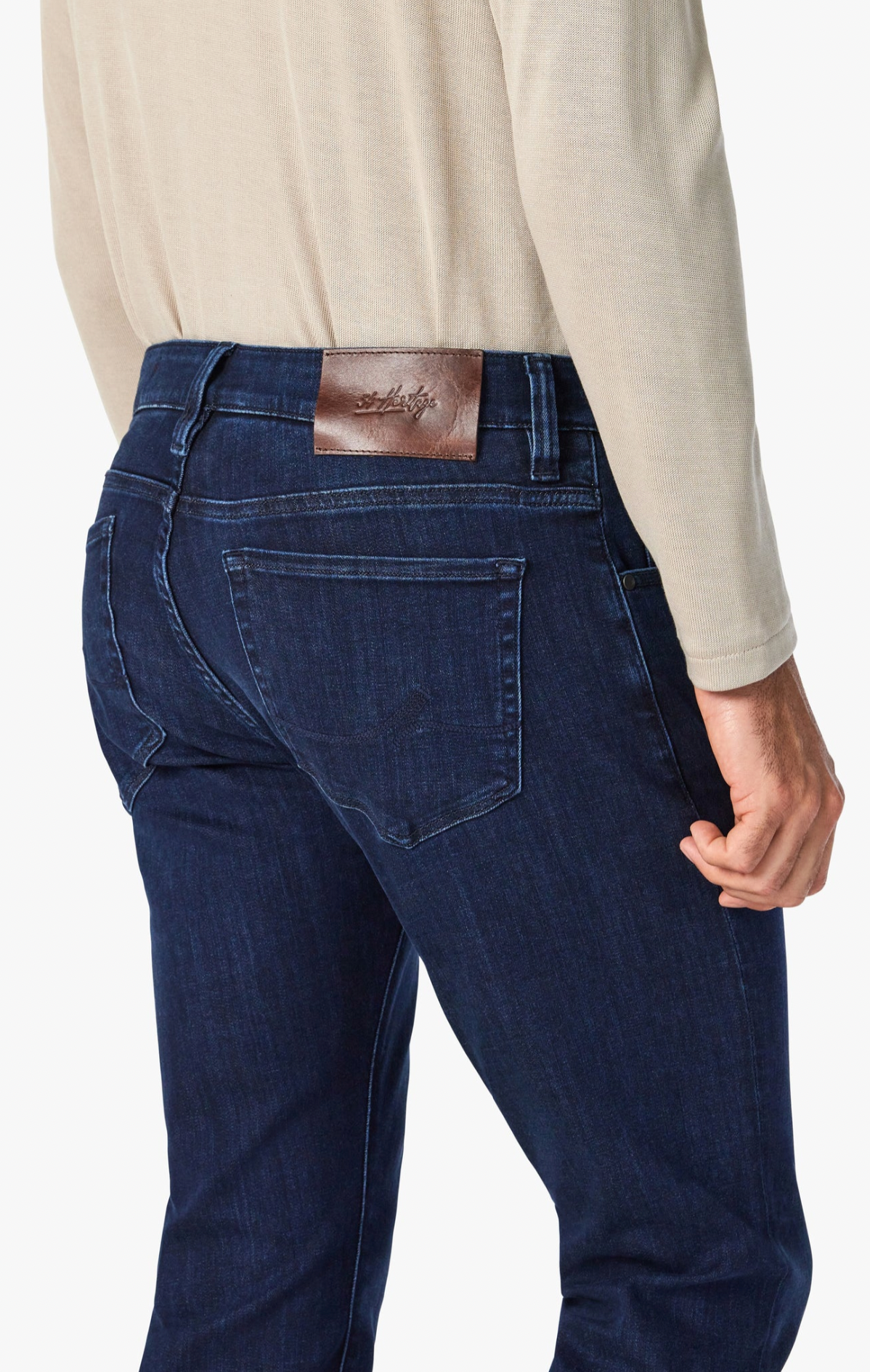 Elevate any occasion in this pair of sleek, dark-wash jeans cut from denim with a luxe look and feel. Made for movement with a higher proportion of elastane, this pair still maintains the texture of an authentic jean. A modern straight leg feels just roomy enough while flattering from every angle.