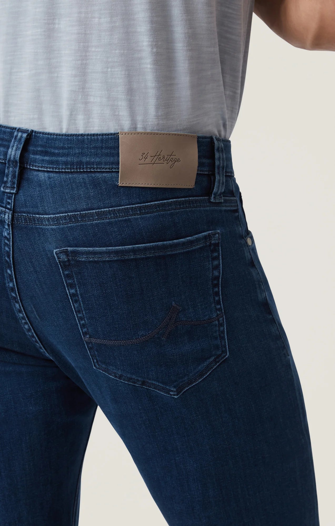 Crafted with a modern mid-rise and an ultra-comfortable straight-leg fit, these jeans offer the perfect balance of contemporary style and timeless appeal. Made from premium, sustainable recycled materials, they’re finished in a sleek night blue wash for an effortlessly refined look ideal for everyday wear.