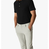 Designed For Comfort These timeless, slim trousers are made from a breathable and stretchy performance fabrication that’s as easy to lounge in as it is to wear for a night out. Finished in a contemporary neutral hue and carefully tailored to flatter every silhouette, this is an elevated closet staple that’s perfect for the man seeking a versatile pant for any occasion in life.