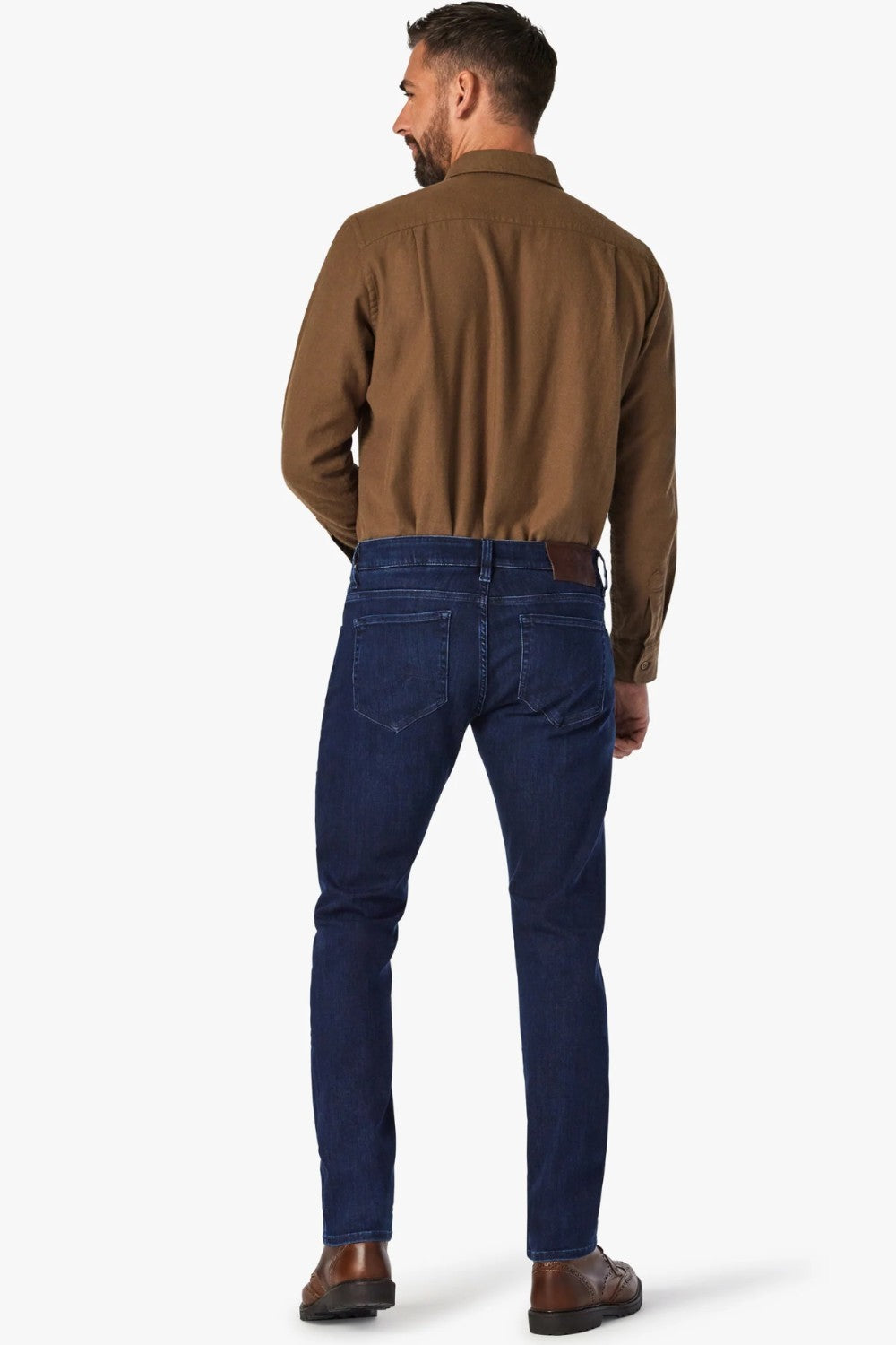 Dress up the everyday with this dark-wash jean designed with a streamlined slim leg and denim that has a luxe look and feel. The fabrication has a higher proportion of elastane for maximum stretch, all while maintaining the appearance of an authentic, elegant jean.