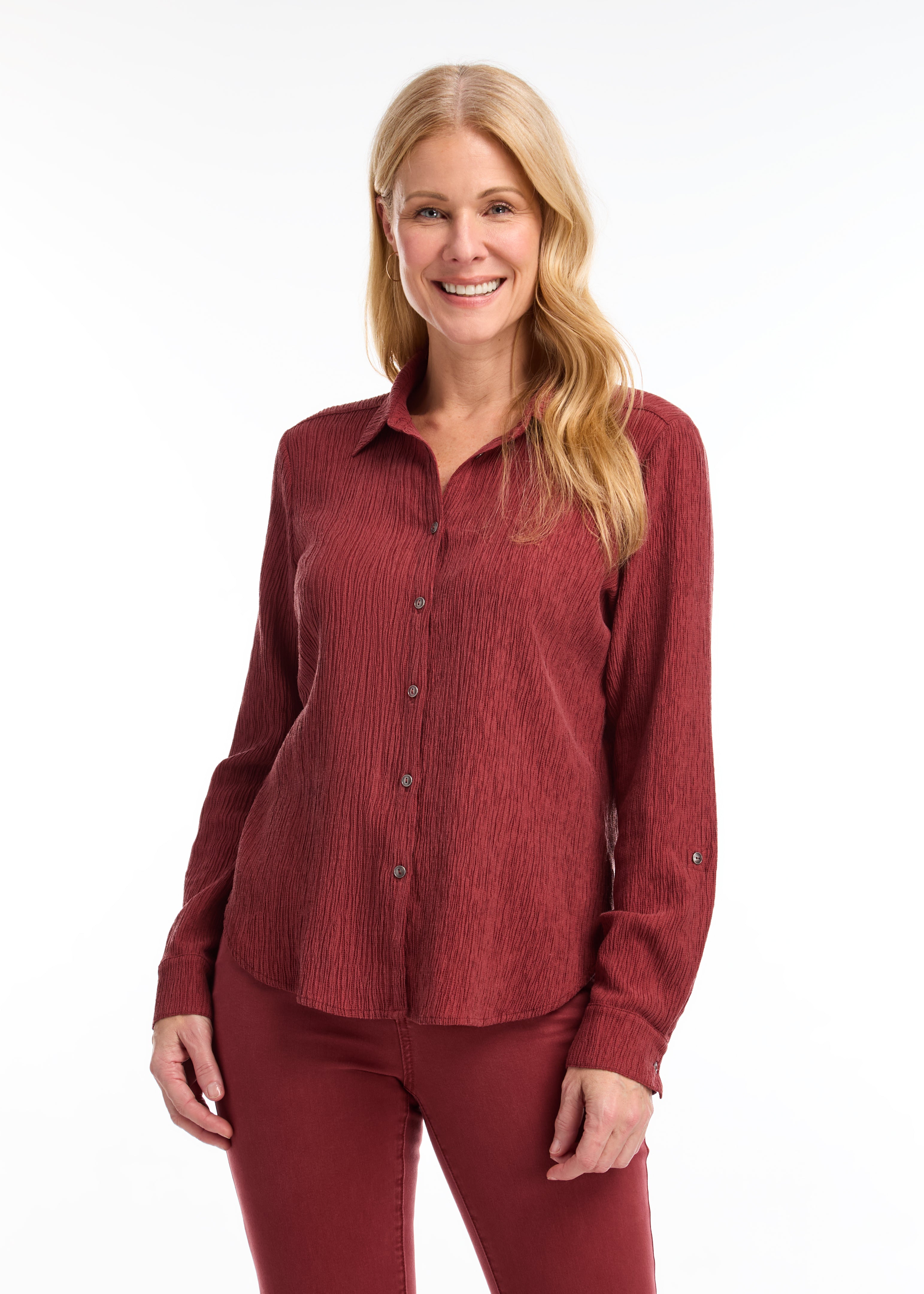 Introducing the FDJ Long Sleeve Roll Up Crinkle Shirt. This solid rust-coloured shirt features a full button front and a traditional collar. The roll tab sleeves add a touch of versatility, making this shirt perfect for most occasions. Stay stylish and comfortable with FDJ.