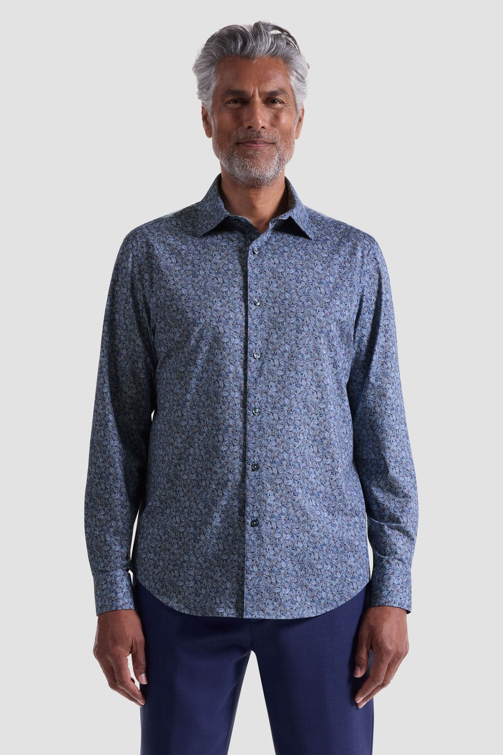 The James OoohCotton long-sleeved shirt in leaf print features a point collar, mother-of-pearl buttons, and a curved hem for a sleek tucked or untucked look. The notched cuffs are adjustable to allow for customized fit and also convertible to accommodate cufflinks. OoohCotton® is a performance, double-mercerized, wrinkle-resistant, breathable, and easy-care cotton blend with 8-way stretch, quick-dry, and thermal comfort properties.
