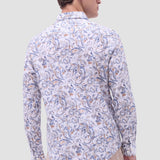 The Julian long-sleeve shirt is crafted from a linen and cotton fabric. It features a point collar, a curved hem that can be worn tucked or untucked, mother-of-pearl buttons, and notched cuffs adjustable for a custom fit-wear them snug or loose. The combination of both fibers balances the crispness of linen with the softness and resilience of cotton to create a comfortable shirt perfect for any occasion.