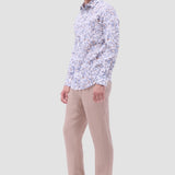 The Julian long-sleeve shirt is crafted from a linen and cotton fabric. It features a point collar, a curved hem that can be worn tucked or untucked, mother-of-pearl buttons, and notched cuffs adjustable for a custom fit-wear them snug or loose. The combination of both fibers balances the crispness of linen with the softness and resilience of cotton to create a comfortable shirt perfect for any occasion.