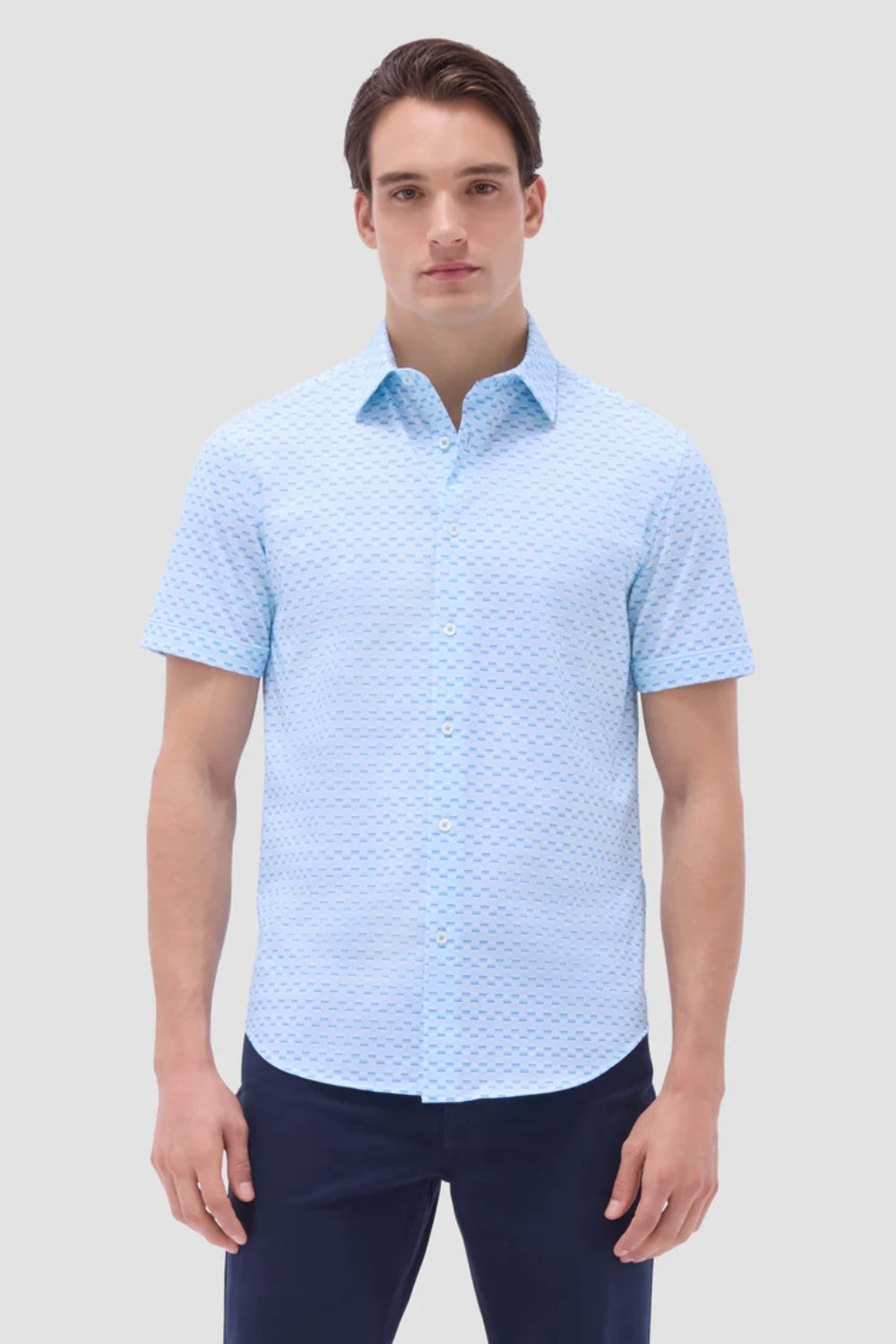 The Miles OoohCotton short-sleeve shirt in basketweave print features a point collar, mother-of-pearl buttons, and a curved hem for a sleek tucked or untucked look. OoohCotton is a performance, double-mercerized, wrinkle-resistant, breathable, and easy-care cotton blend with 8-way stretch, quick-dry, and thermal comfort properties.