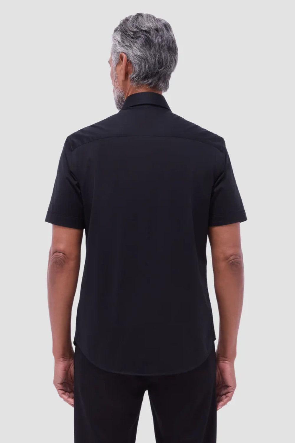 The Miles solid OoohCOtton short-sleeved shirt features a point collar, mother-of-pearl buttons, and a curved hem perfect for wearing tucked or untucked. OoohCOtton is a performance, double-mercerized, wrinkle-resistant, breathable, and easy-care cOtton blend with 8-way stretch, quick-dry, and thermal comfort properties.