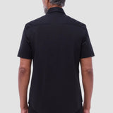 The Miles solid OoohCOtton short-sleeved shirt features a point collar, mother-of-pearl buttons, and a curved hem perfect for wearing tucked or untucked. OoohCOtton is a performance, double-mercerized, wrinkle-resistant, breathable, and easy-care cOtton blend with 8-way stretch, quick-dry, and thermal comfort properties.