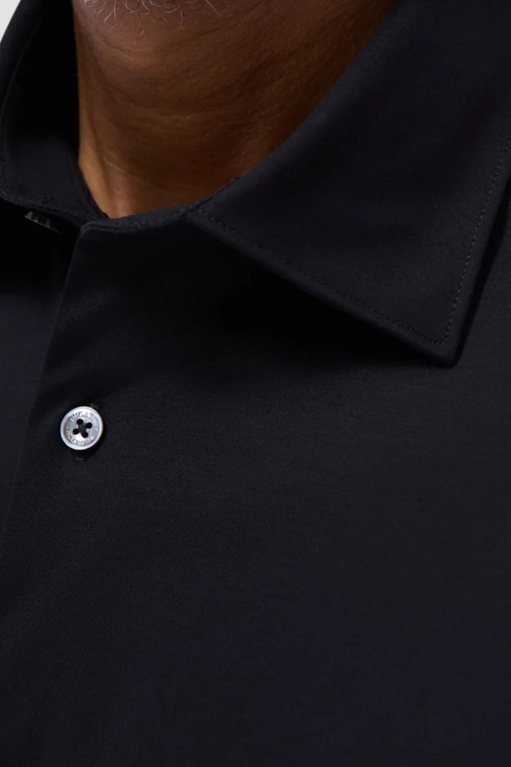 The Miles solid OoohCOtton short-sleeved shirt features a point collar, mother-of-pearl buttons, and a curved hem perfect for wearing tucked or untucked. OoohCOtton is a performance, double-mercerized, wrinkle-resistant, breathable, and easy-care cOtton blend with 8-way stretch, quick-dry, and thermal comfort properties.