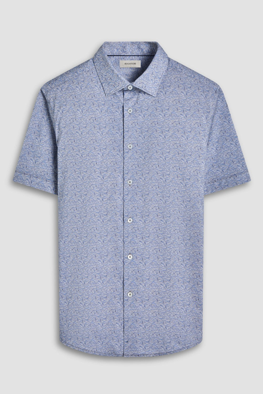 The Miles short-sleeved shirt features a chambray effect print on OoohCotton fabric, a point collar, genuine shell buttons, and a curved hem. OoohCotton is a double-mercerized, wrinkle-resistant, breathable, and easy-care cotton blend with 8-way stretch, quick-dry, and thermal comfort properties.