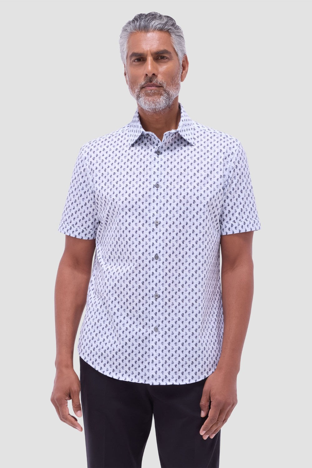 The Miles OoohCotton short-sleeve shirt in toucan print features a point collar, mother-of-pearl buttons, and a curved hem for a sleek tucked or untucked look. OoohCotton is a performance, double-mercerized, wrinkle-resistant, breathable, and easy-care cotton blend with 8-way stretch, quick-dry, and thermal comfort properties.