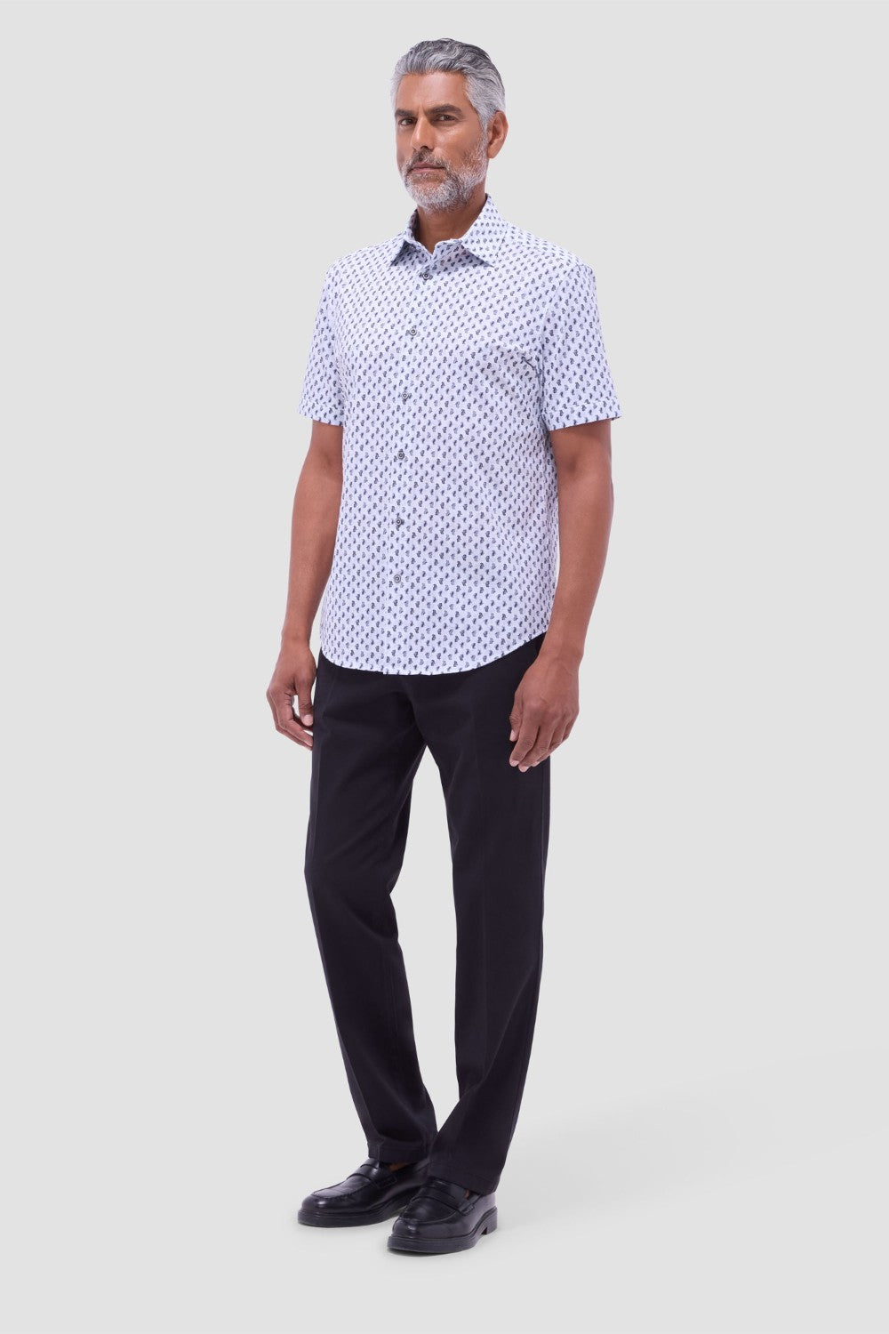 The Miles OoohCotton short-sleeve shirt in toucan print features a point collar, mother-of-pearl buttons, and a curved hem for a sleek tucked or untucked look. OoohCotton is a performance, double-mercerized, wrinkle-resistant, breathable, and easy-care cotton blend with 8-way stretch, quick-dry, and thermal comfort properties.