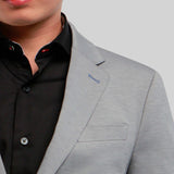 Sporty enough to wear with a t-shirt or knit, and dressy enough to wear with a woven shirt; this blazer breaks the mold of a traditional black jacket.