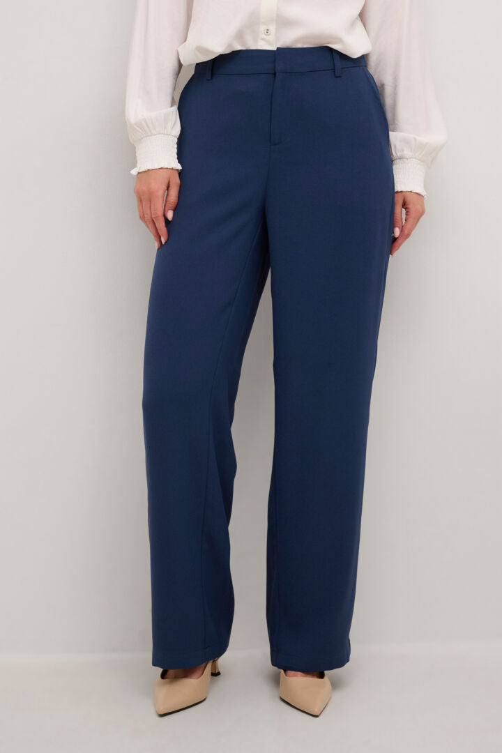 The Cream Cocamia Pant is a versatile and stylish addition to any wardrobe. With its blue colour, this pant offers a sleek and sophisticated look. The zip and button closure, along with the elastic back waist, provide a comfortable fit for all-day wear. Complete with pockets and belt loops, this pant offers both style and functionality.