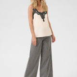 A basic wardrobe essential with an elevated look! The Cream Anna Top is a cami you’re sure to love – it features a classic colour and its comfortable, adjustable straps make it a top that's sure to win you over. Classy enough for a meeting, yet fun enough for drinks with friends? Yes please!