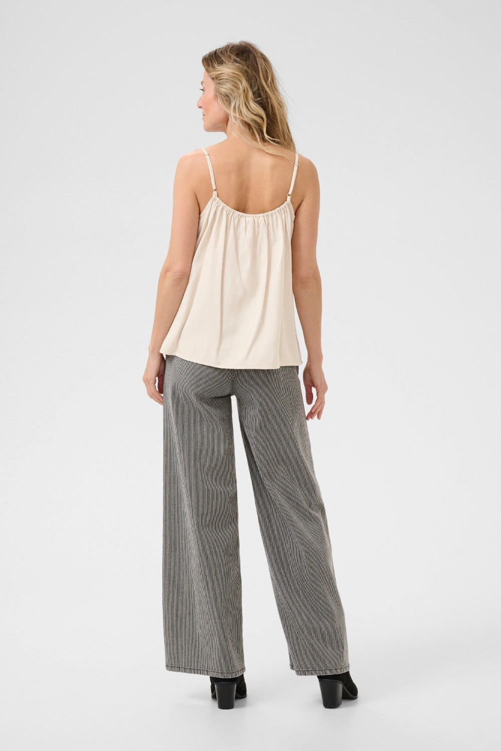 A basic wardrobe essential with an elevated look! The Cream Anna Top is a cami you’re sure to love – it features a classic colour and its comfortable, adjustable straps make it a top that's sure to win you over. Classy enough for a meeting, yet fun enough for drinks with friends? Yes please!