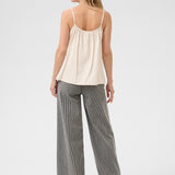 A basic wardrobe essential with an elevated look! The Cream Anna Top is a cami you’re sure to love – it features a classic colour and its comfortable, adjustable straps make it a top that's sure to win you over. Classy enough for a meeting, yet fun enough for drinks with friends? Yes please!