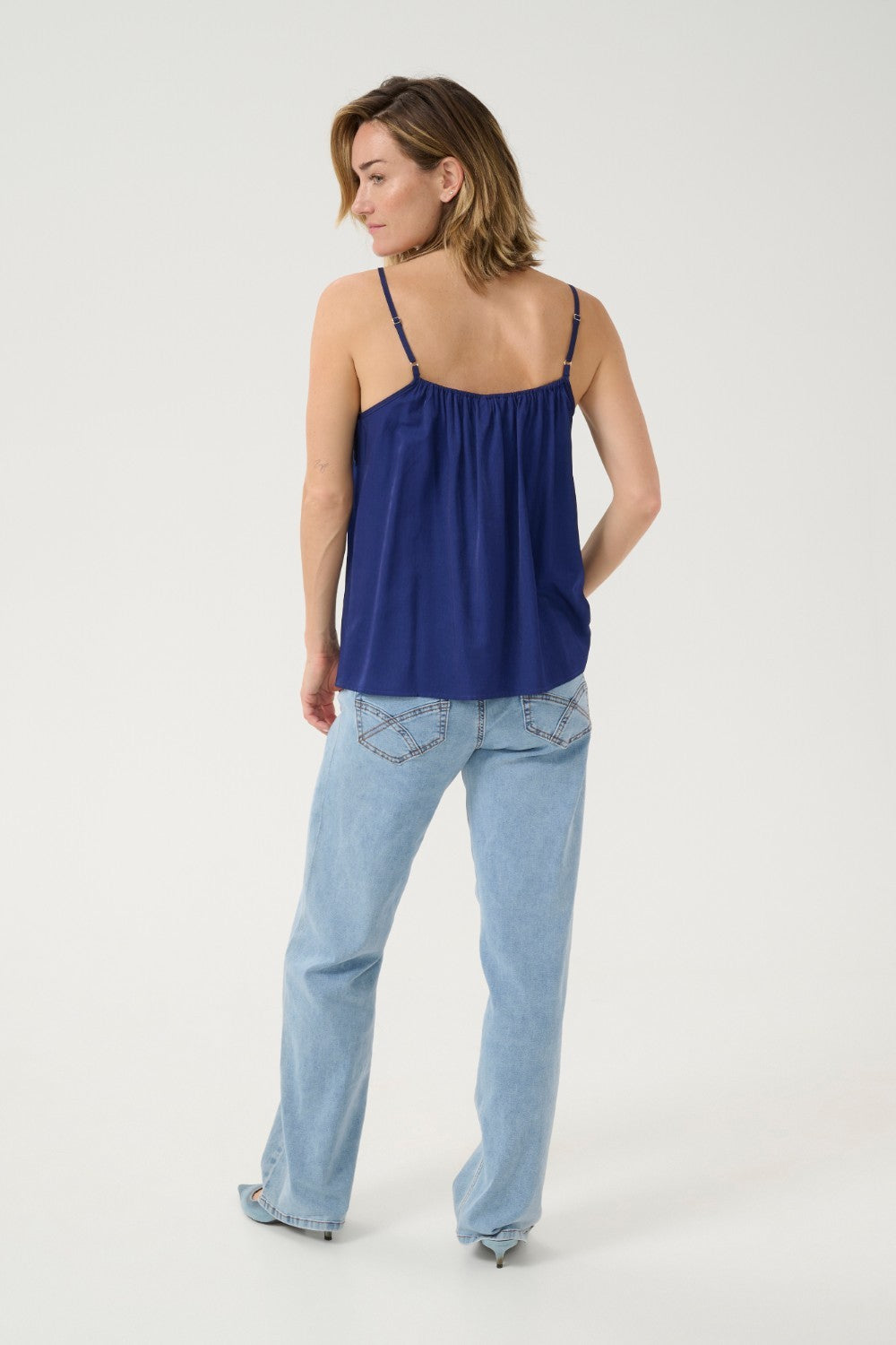 A basic wardrobe essential with an elevated look! The Cream Anna Top is a cami you’re sure to love – it features a classic colour and its comfortable, adjustable straps make it a top that's sure to win you over. Classy enough for a meeting, yet fun enough for drinks with friends? Yes please!