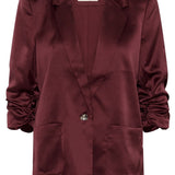 Maroon blazer with a brand label on a white background