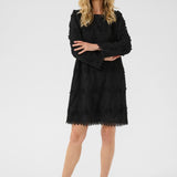 Woman wearing a black dress on a white background