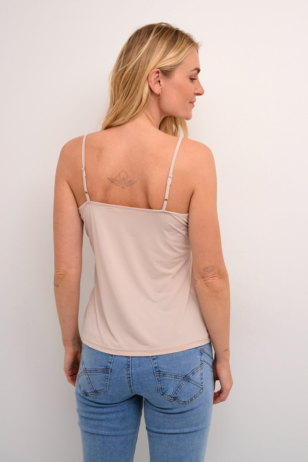 The Cream Lissandra Sliptop is an essential everyday cami designed for versatile layering. This sophisticated piece provides extra coverage beneath sheer tops while maintaining a sleek silhouette. The neutral tone ensures seamless integration with your existing wardrobe, making it an indispensable foundation garment for creating polished, layered ensembles.