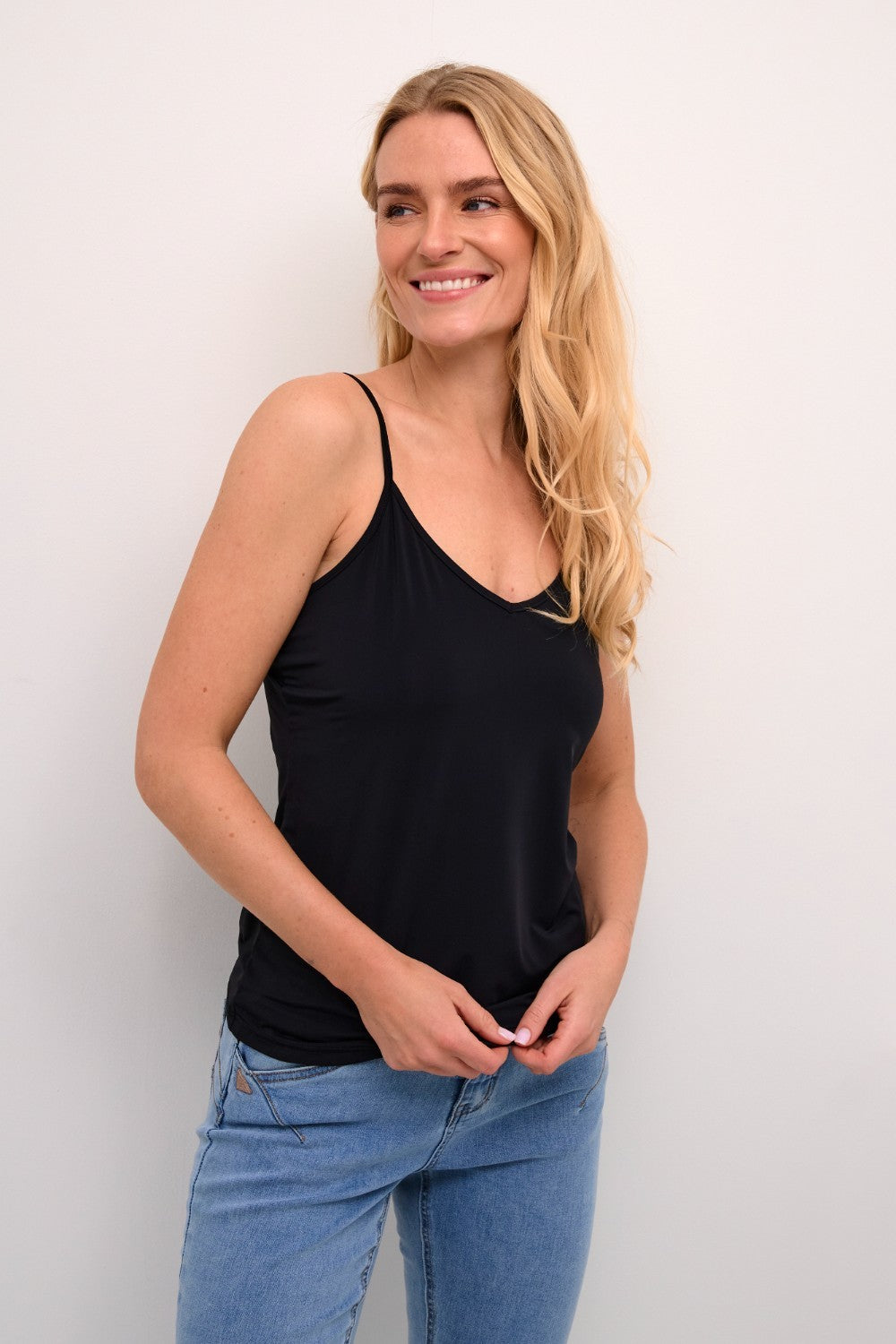 The Cream Lissandra Sliptop is an essential everyday cami designed for versatile layering. This sophisticated piece provides extra coverage beneath sheer tops while maintaining a sleek silhouette. The neutral tone ensures seamless integration with your existing wardrobe, making it an indispensable foundation garment for creating polished, layered ensembles.