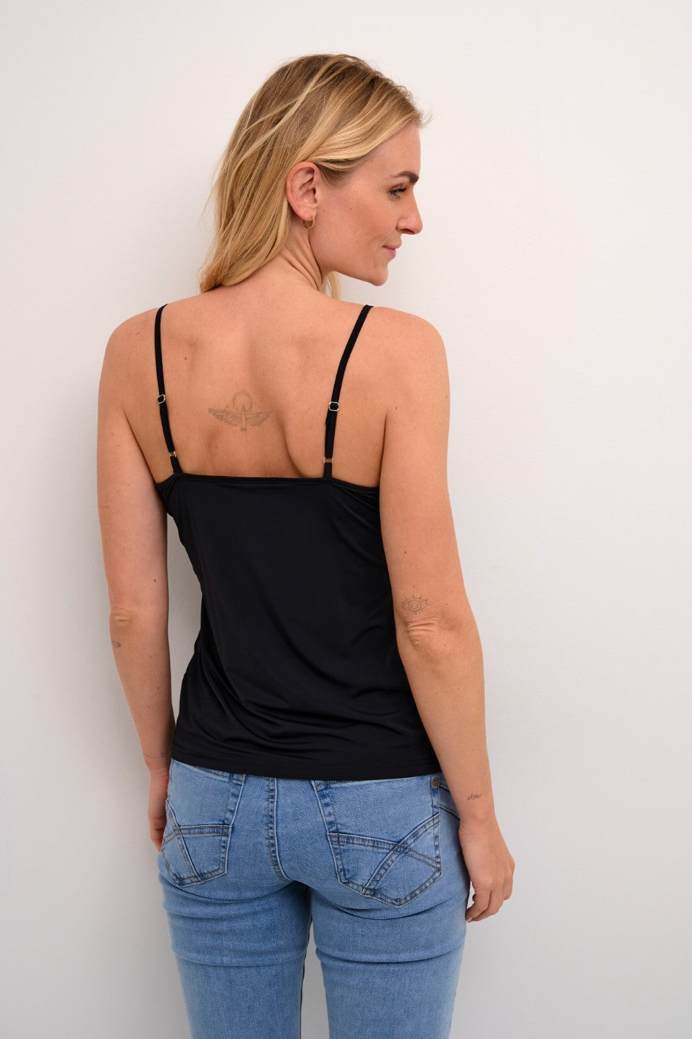 The Cream Lissandra Sliptop is an essential everyday cami designed for versatile layering. This sophisticated piece provides extra coverage beneath sheer tops while maintaining a sleek silhouette. The neutral tone ensures seamless integration with your existing wardrobe, making it an indispensable foundation garment for creating polished, layered ensembles.