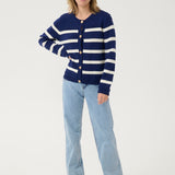 Get ready to set sail in style with our Cream Muka Knit Cardigan. With nautical stripes and striking gold buttons, this piece is both classic and eye-catching. Perfect for adding a touch of seafaring charm to any outfit. Anchors away!