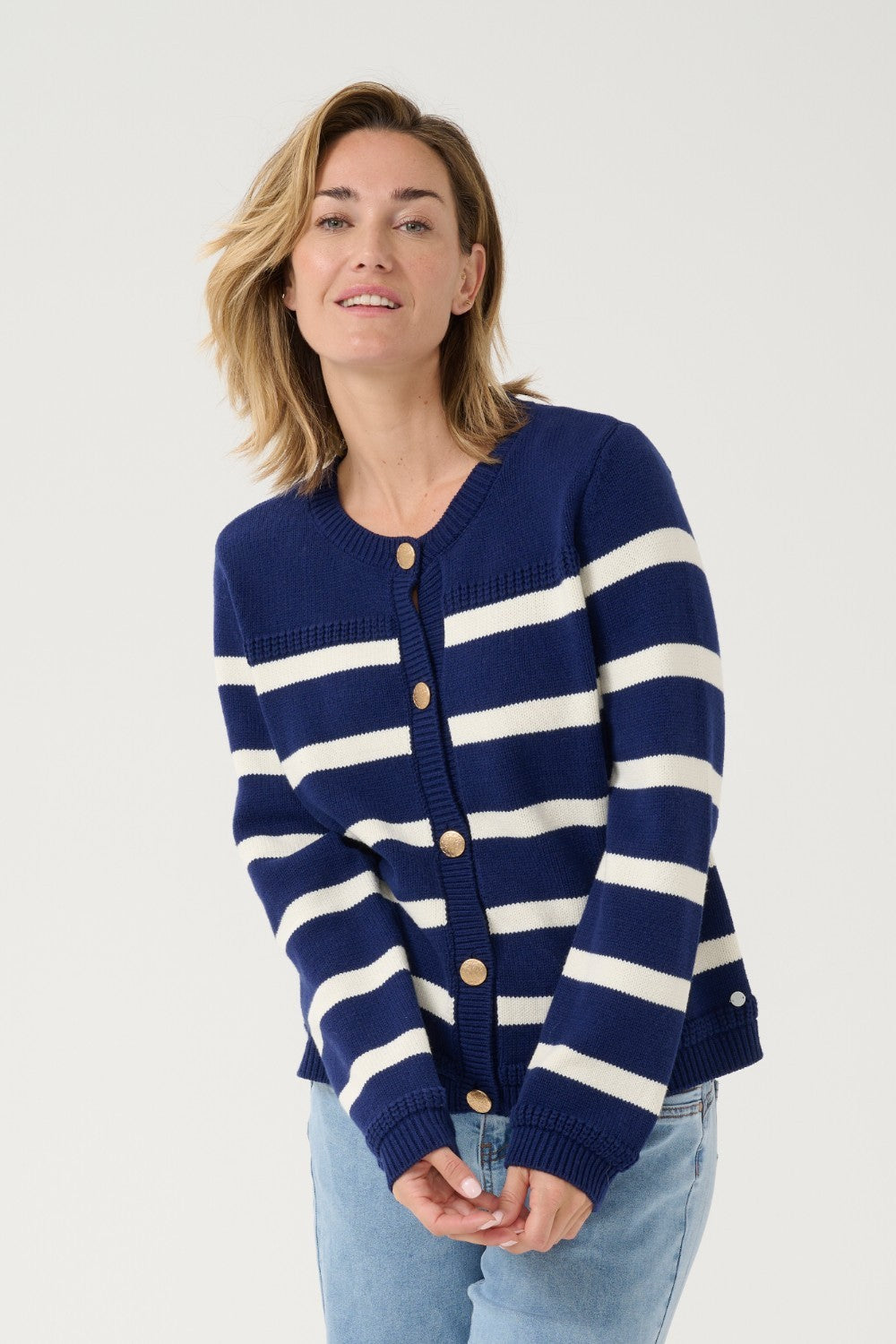 Get ready to set sail in style with our Cream Muka Knit Cardigan. With nautical stripes and striking gold buttons, this piece is both classic and eye-catching. Perfect for adding a touch of seafaring charm to any outfit. Anchors away!