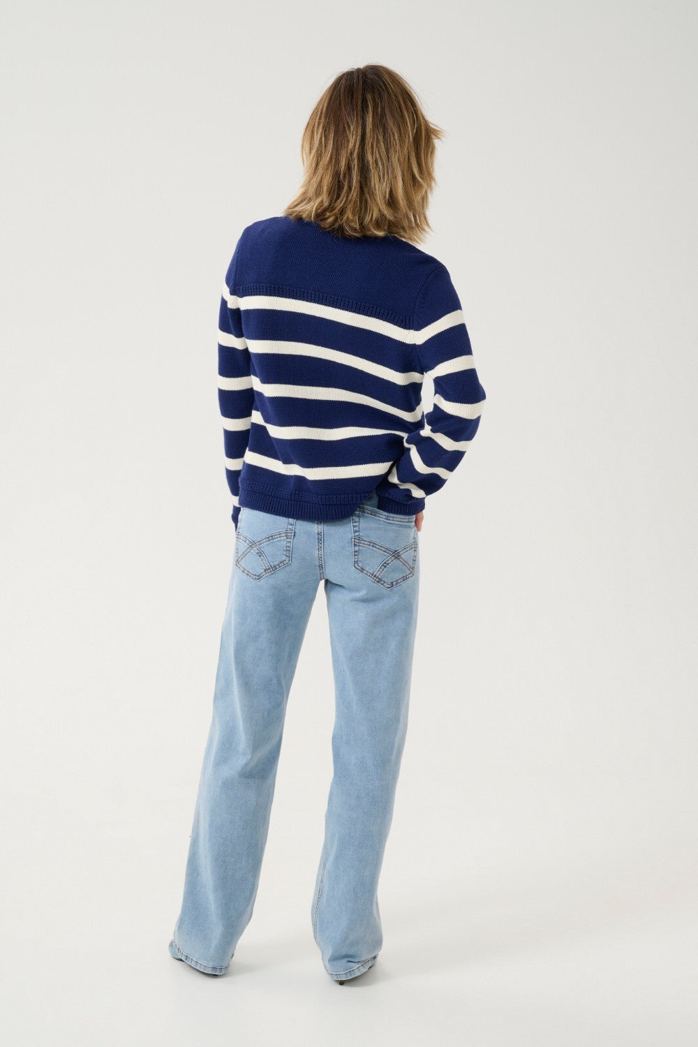 Get ready to set sail in style with our Cream Muka Knit Cardigan. With nautical stripes and striking gold buttons, this piece is both classic and eye-catching. Perfect for adding a touch of seafaring charm to any outfit. Anchors away!