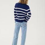 Get ready to set sail in style with our Cream Muka Knit Cardigan. With nautical stripes and striking gold buttons, this piece is both classic and eye-catching. Perfect for adding a touch of seafaring charm to any outfit. Anchors away!