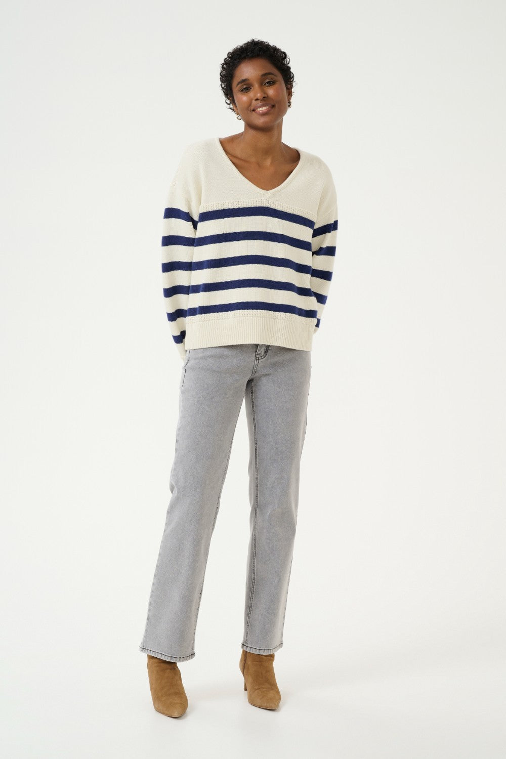 Sail away in style with the Cream Muka Knit Pullover. This nautical-inspired v-neck sweater is made of a comfortable cotton blend, perfect for any casual occasion. Smooth sailing guaranteed!