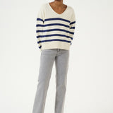 Sail away in style with the Cream Muka Knit Pullover. This nautical-inspired v-neck sweater is made of a comfortable cotton blend, perfect for any casual occasion. Smooth sailing guaranteed!