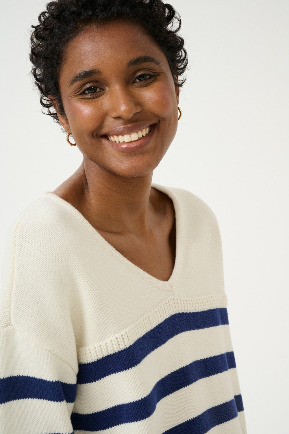 Sail away in style with the Cream Muka Knit Pullover. This nautical-inspired v-neck sweater is made of a comfortable cotton blend, perfect for any casual occasion. Smooth sailing guaranteed!