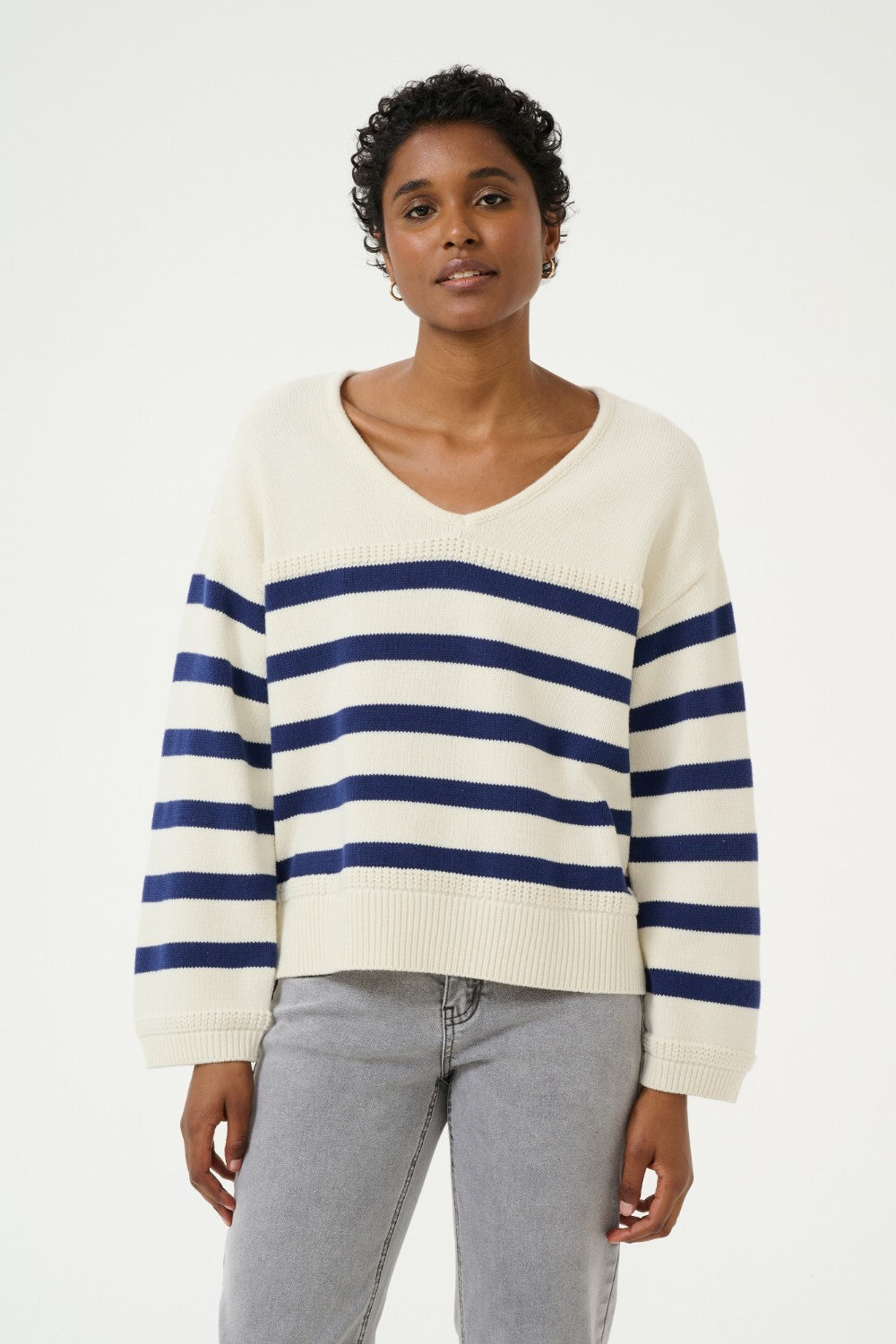 Sail away in style with the Cream Muka Knit Pullover. This nautical-inspired v-neck sweater is made of a comfortable cotton blend, perfect for any casual occasion. Smooth sailing guaranteed!