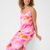 Experience cool comfort in our Cream Nana Slip Dress. This cheerful piece is perfect for any casual occasion, offering a relaxed and effortless style. Stay stylish while feeling at ease in this must-have dress.