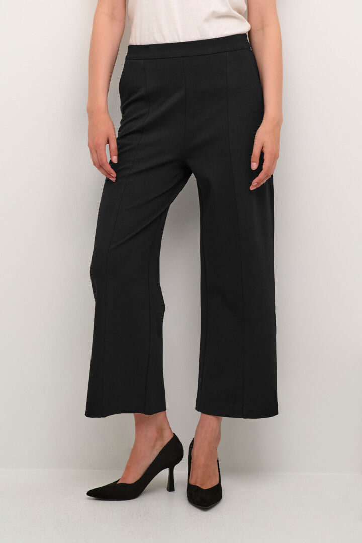 The Cream Saila Jersey Pant offers comfortable and effortless style with its pitch black colour, wide leg fit, and slip on comfort waist. Its pin tuck detailing and convenient pockets make them a versatile and functional addition to any wardrobe.