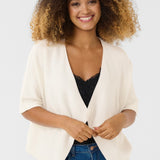 Our Cream Sillar Knit Bolero is back by popular demand! Made from 100% cotton, this cardigan makes layering easy and stylish. Perfect for any occasion, it's a must-have for your wardrobe.