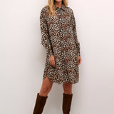 Unleash your wild side with our Cream Tiah Shirt Dress, featuring a playful leopard print. Made from lightweight material, this dress is perfect for casual days and nights. (Liven up your wardrobe with a touch of feline fun!)