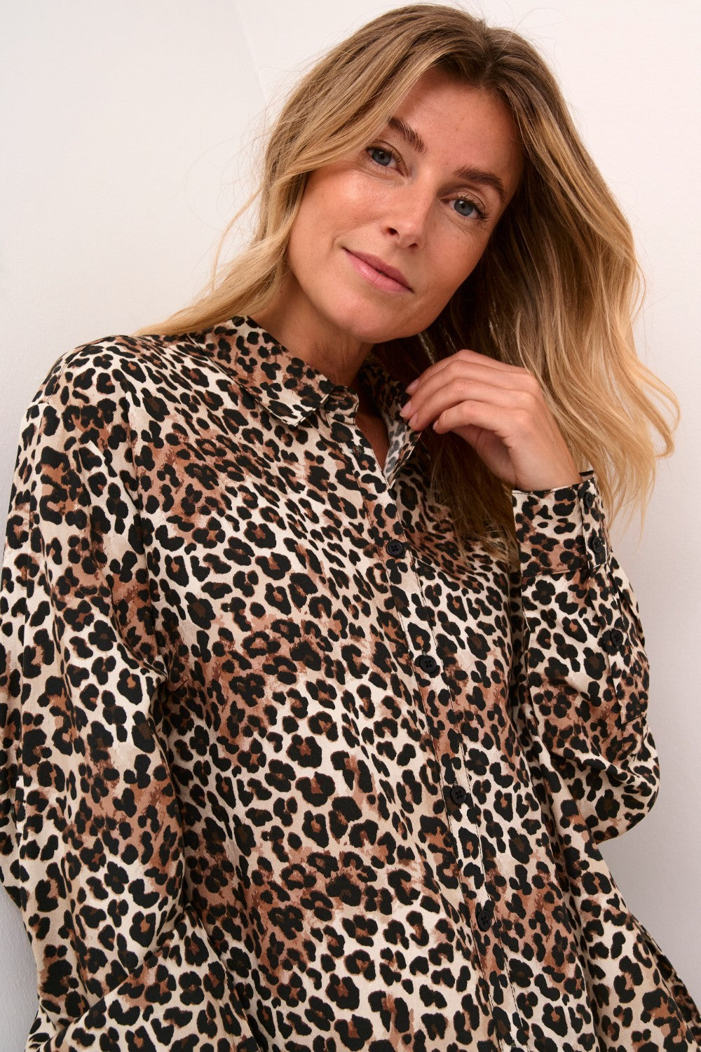 Unleash your wild side with our Cream Tiah Shirt Dress, featuring a playful leopard print. Made from lightweight material, this dress is perfect for casual days and nights. (Liven up your wardrobe with a touch of feline fun!)