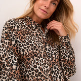 Unleash your wild side with our Cream Tiah Shirt Dress, featuring a playful leopard print. Made from lightweight material, this dress is perfect for casual days and nights. (Liven up your wardrobe with a touch of feline fun!)